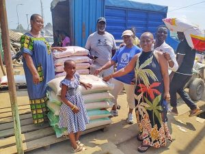 Charity volunteers distributing rice donations for families
