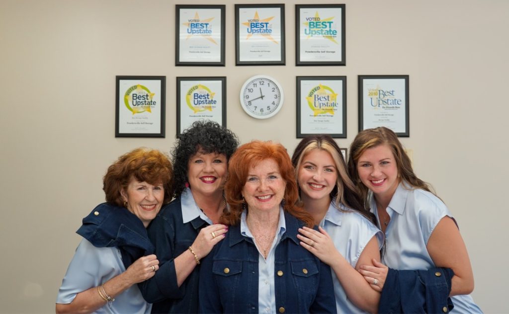 Powdersville Self Storage team members with awards displayed