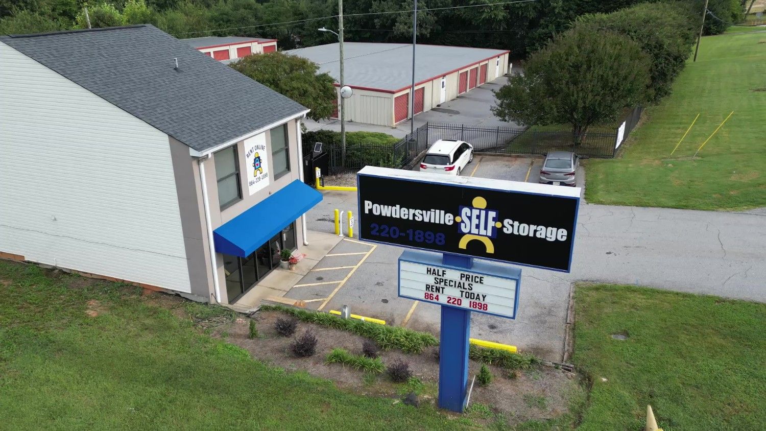 Exterior view of Powdersville Self Storage facility with signage